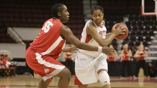 Jesyka Burks-Jesyka Burks-Wiley holding the ball with a defender guarding herWiley holding the ball with a defender guarding her