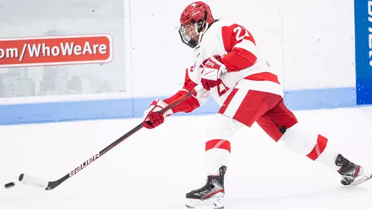 Madison Cardaci shooting a puck