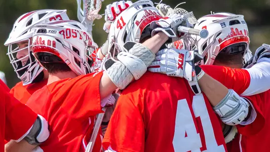 The men's lacrosse team celebrates a win