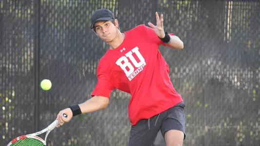 Adrian Pawlowski swings a wide forehand on an approaching tennis ball.