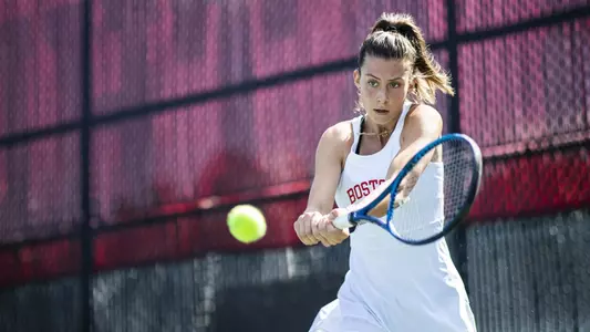 Michelle Kleynerman makes contact on a tennis ball with her double handed backhand.