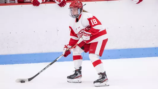 Haylee Blinkhorn skating with the puck