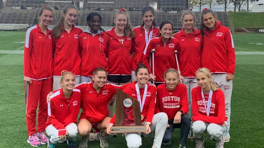 The women's cross country team with the Patriot League runner-up trophy