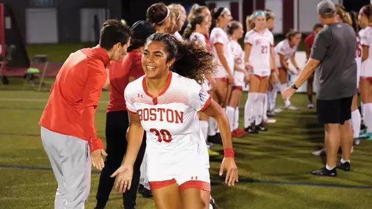 Geovanna Pereira is at the end of the player tunnel and high-fived a BU coach.
