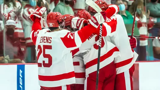 Men's Ice Hockey players celebrate a goal