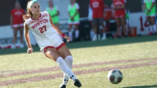 Eileen Solomon kicks a soccer ball