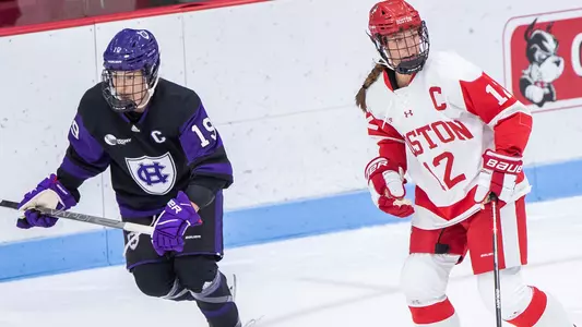 Kaleigh Donnelly skating next to a Holy Cross player