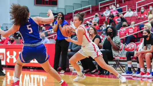 Maggie Pina Dribbles Against a UMass Lowell defender.