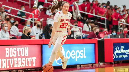 Emily Esposito dribbles across center court against UMass Lowell.