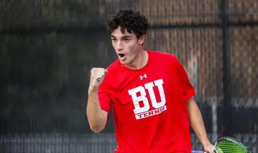 Dion Loutas gives a fist pump and scream after winning a tennis point.