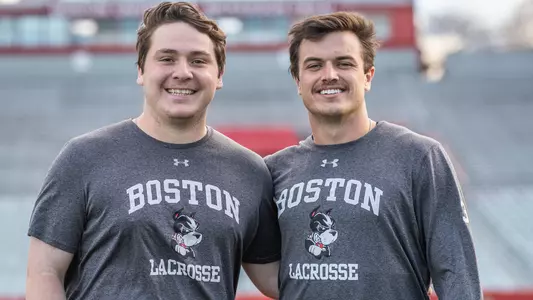 Timmy Ley and Matt Hilburn pose for a photo on Nickerson Field