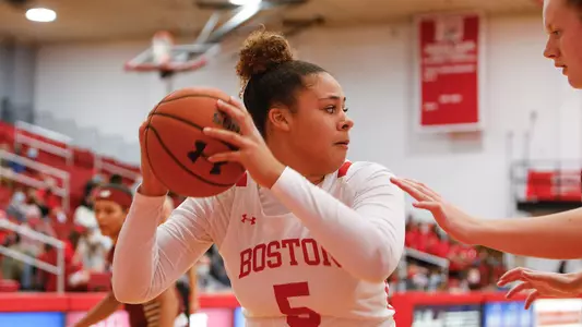 Chiara Tibbitt looks to pass while occupying the right block against Boston College.
