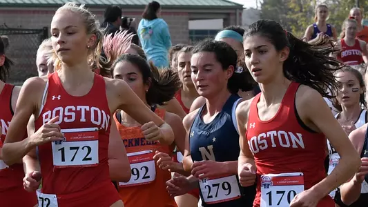 Andrea Claeson and Corinne Batsu competing at the Patriot League Cross Country Championship