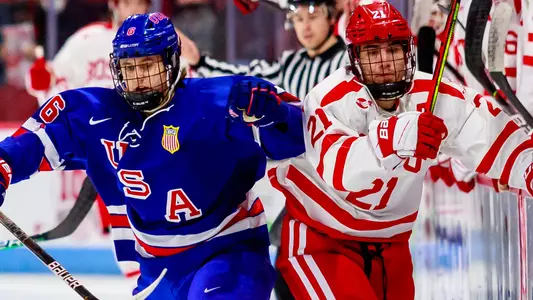 Jack Harvey of the U.S. Under-18 Team battles at center ice with Max Kaufman