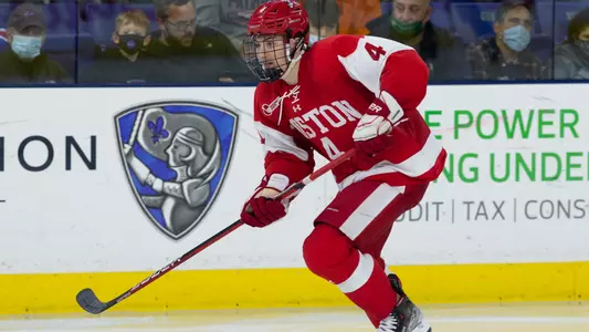Ty Gallagher skating with the puck