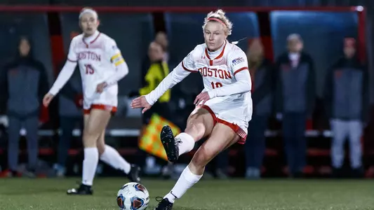 Julianna Stureman kicks a ball during BU's PL Semifinal match against Army.