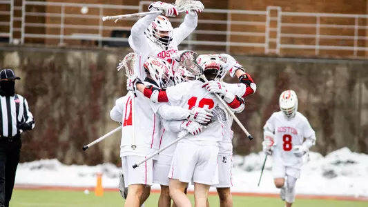 The men's lacrosse team celebrates a goal