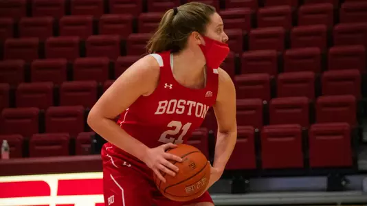 Emily Esposito in the triple threat position looking to pass