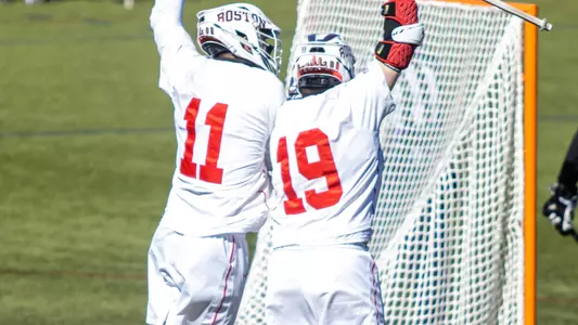 Timmy Ley and Vince D'Alto jump in the air to celebrate a goal
