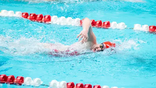 Boston University women's swimmer competing