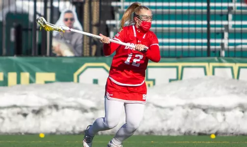 Riley Kokoruda with her stick back looking to pass