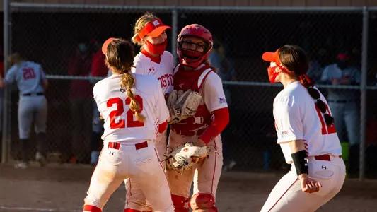 Allison Boaz is greeted by the catcher and two teammates after earning the final strikeout to shut out Stony Brook.