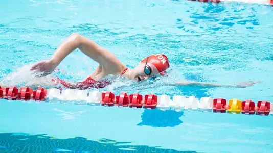 BU women's swimmer midstroke