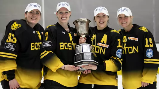 Victoria Hanson, Mary Parker, Kaleigh Fratkin and Sammy Davis pose with the Isobel Cup