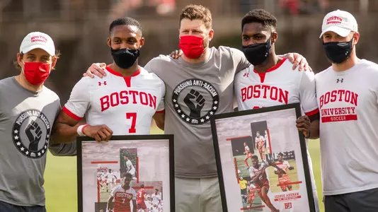 The seniors of the men's soccer team with the coaching staff