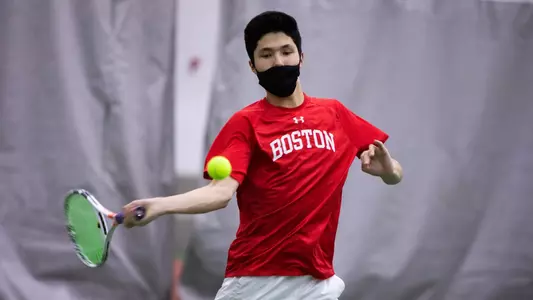 Johann Sojanz is the middle of his forehand swing while the ball is at his waist height level.