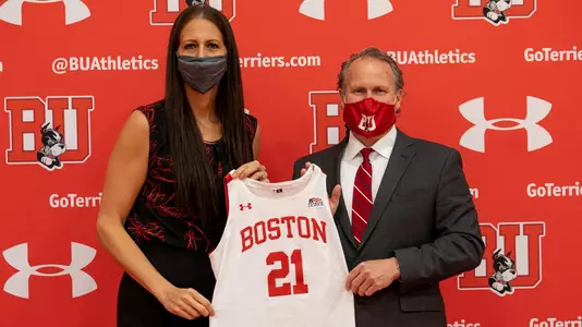 Melissa D'Amico and Drew Marrochello holding a number 21 jersey