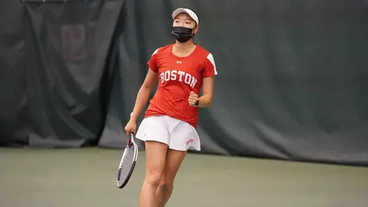 Emily Kim gives a fist pump after winning a point in singles action.