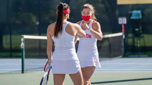 Lily Burchell fist bumping her doubles teammate
