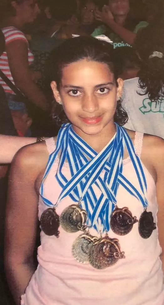 Julimar Avila with medals after a competition