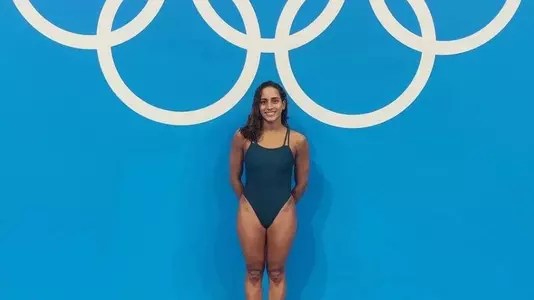 Julimar Avila posing in front of Olympic rings