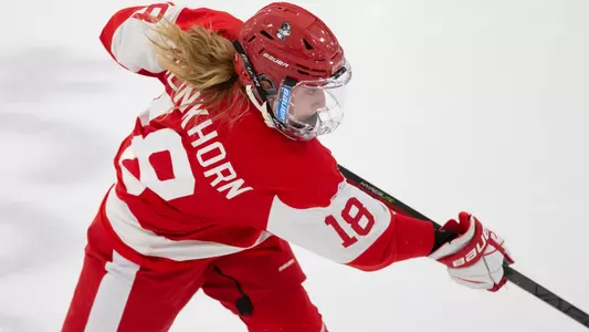 Haylee Blinkhorn shooting a puck