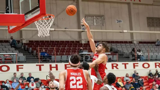 Sukhmail Mathon attempts a hook shot at Hartford.