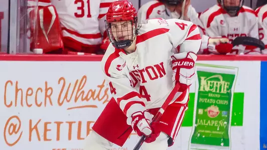 Ty Gallagher skating with the puck