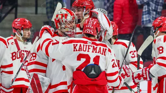 Drew Commesso and Max Kaufman are among the Terriers celebrating a win