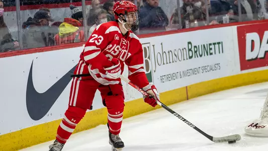 Domenick Fensore is behind his own net with the puck