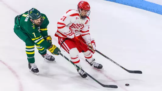 Max Kaufman skating past a Vermont player