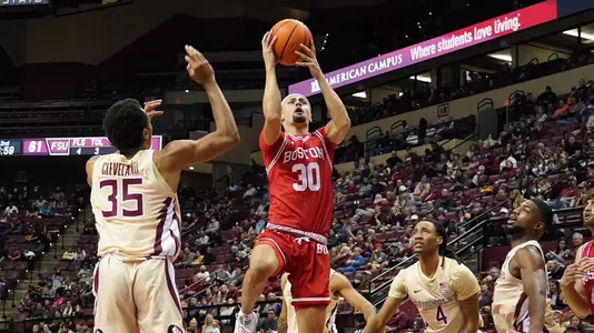 Javante McCoy jumps up in the air for a layup attempt at Florida State.