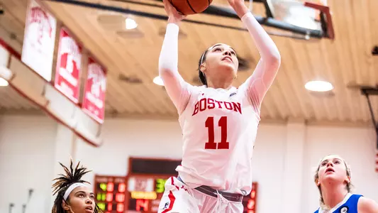 Caitlin Weimar goes for a layup on the right block.