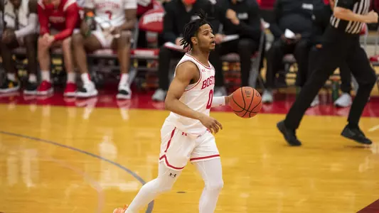 Ethan Brittain-Watts brings the ball up toward mid-court.
