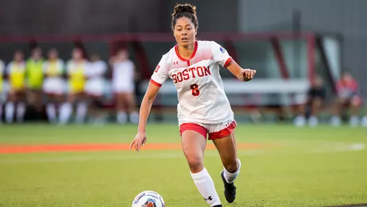 Photo of women's soccer senior Marli Rajacich dribbling the ball against Providence.