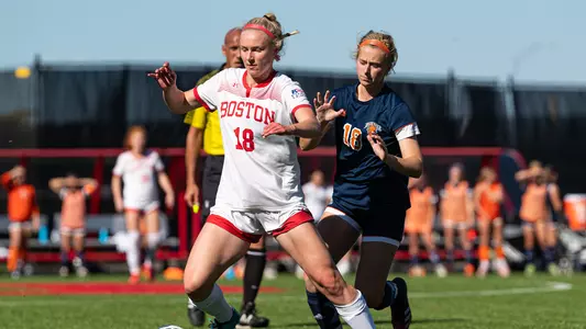 Photo of women's soccer senior Julianna Stureman approaching a ball near a Bucknell marker.
