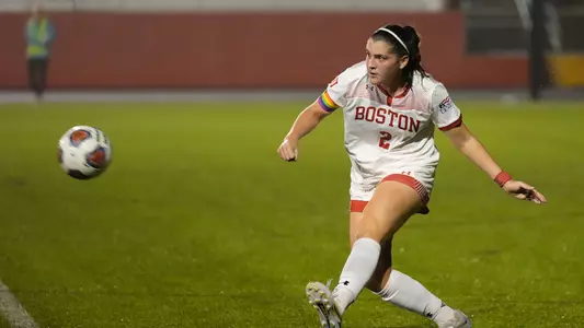 Photo of women's soccer senior Ashley Buck clearing the ball.