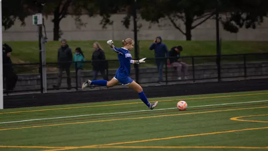 Photo of women's soccer sophomore Celia Braun on a goal kick against Harvard.
