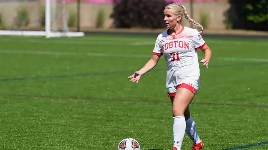 Photo of women's soccer sophomore Hugrún Helgadóttir dribbling the ball against Michigan.