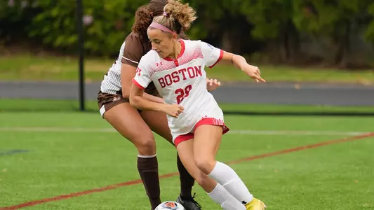 Photo of women's soccer sophomore Morgan Fagan dribbling the ball against a Lehigh defender.